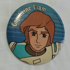 Strange & unusual vintage button pins featuring Capitaine Flam